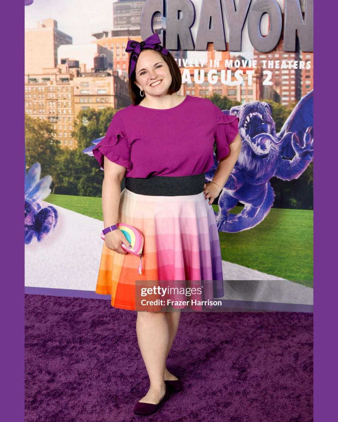 Woman (Art 2 the Extreme® founder, Nicole Lewis)in a colorful rainbow skirt standing in front of a promotional backdrop for 'Harold and the Purple Crayon' movie red carpet premiere.